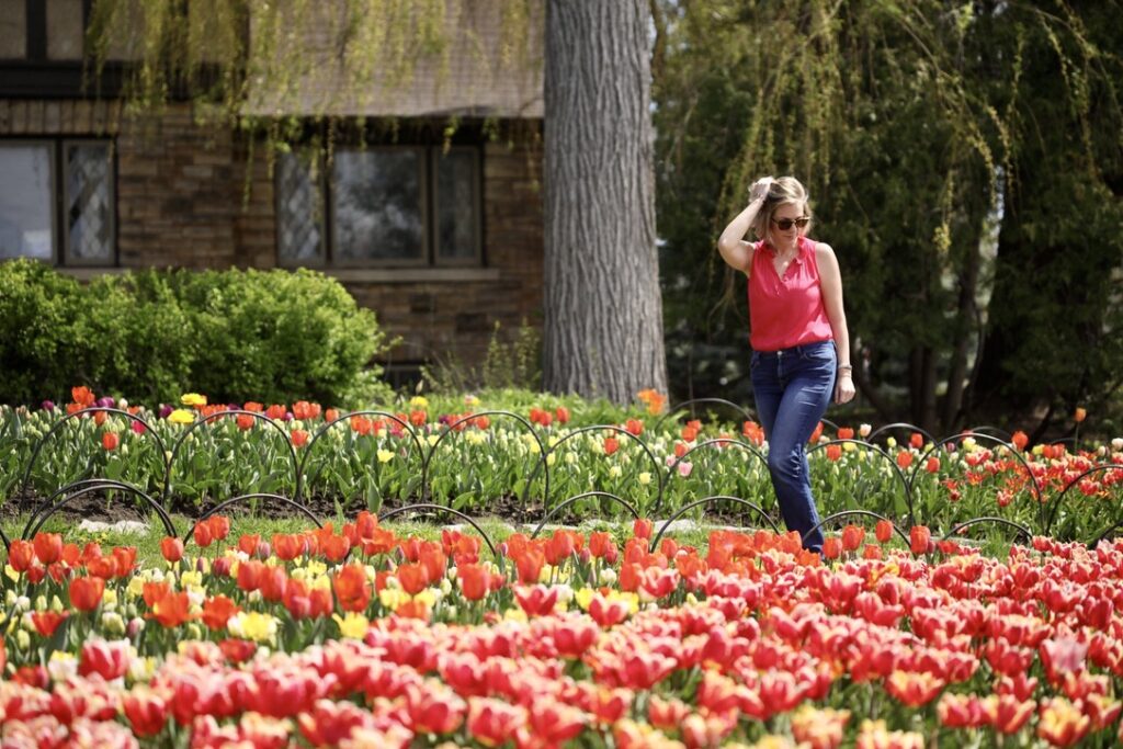 Ali walks past a garden of tulips at Ottawa's Tulip Festival 2024.