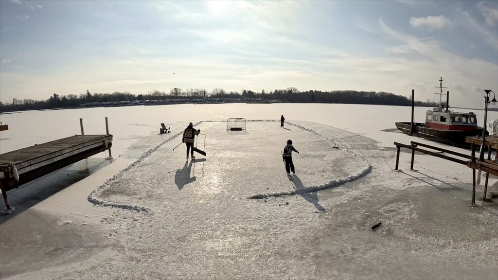 Ali and family clear a ice rink on Lake Ontario to play hockey.