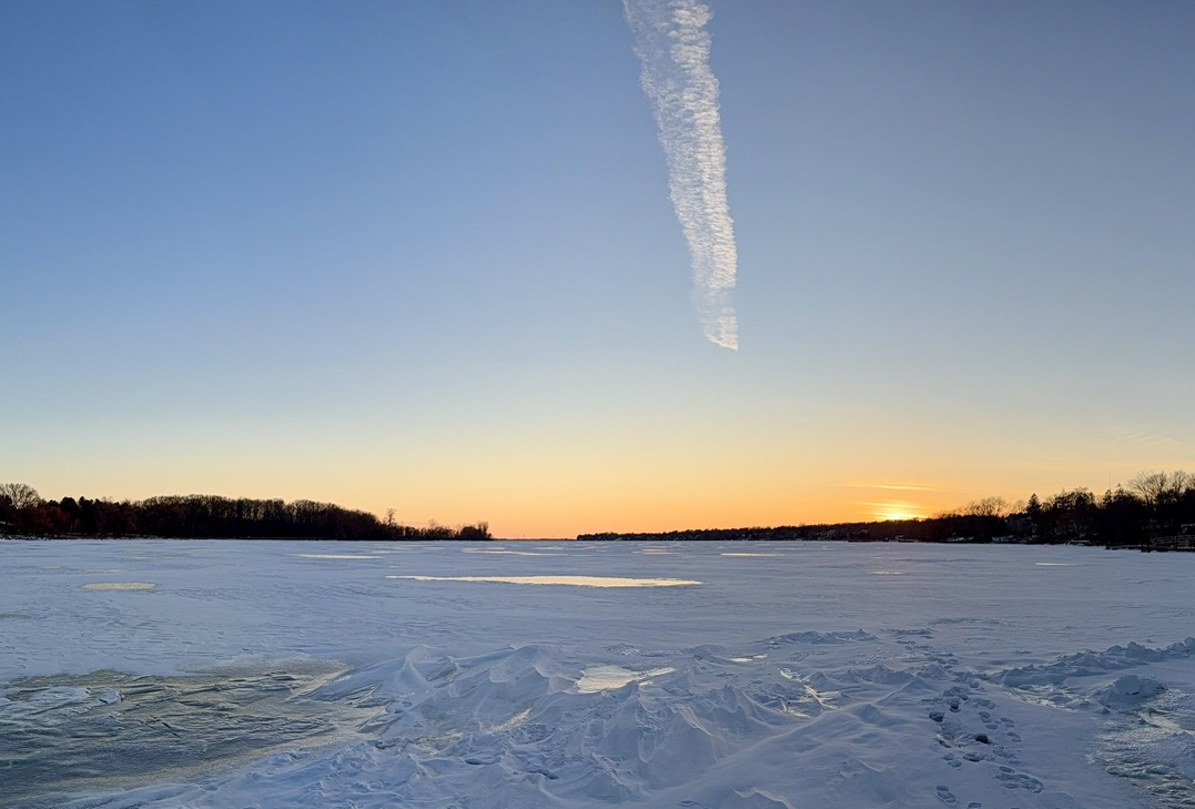 Sunset over a frozen lake.