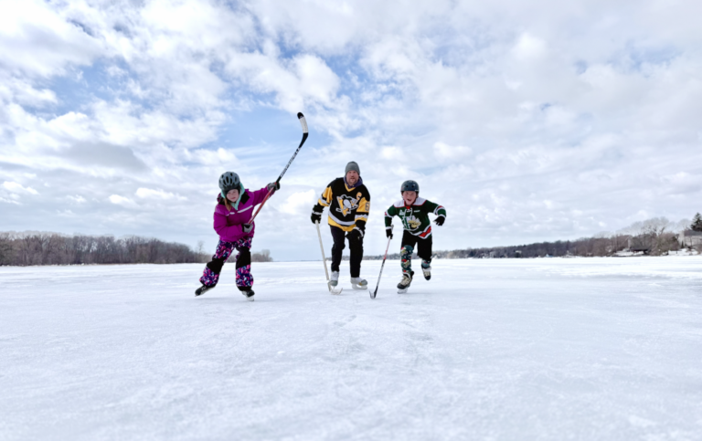 family skates on a frozen lake ontario